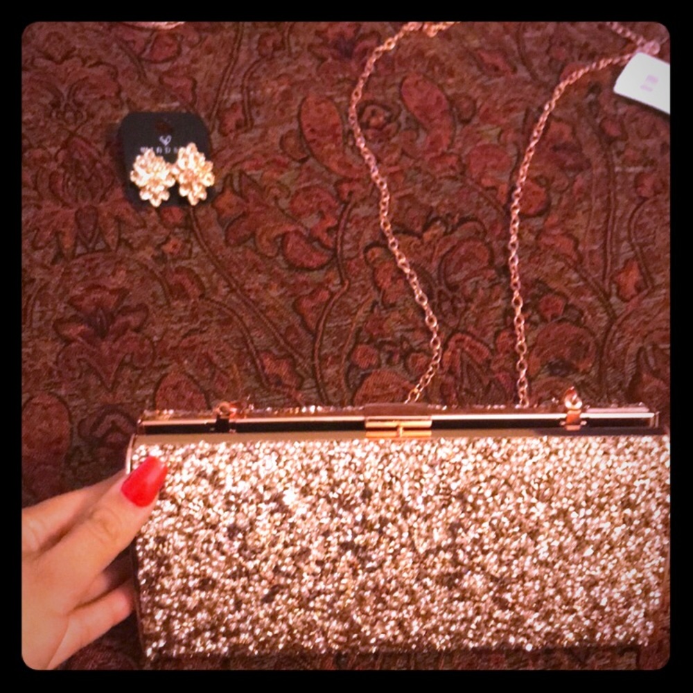 Rose gold clutch w/studs. Brand new. Beautiful!
